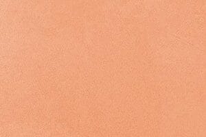 Amostra de microcimento KCberry na cor Orange — acabamento continuo, sem juntas