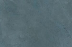 Amostra de microcimento PURE base cal KCberry na cor Cianite — textura mineral continua, sem juntas