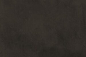 Amostra de microcimento PURE base cal KCberry na cor Coal — textura mineral continua, sem juntas