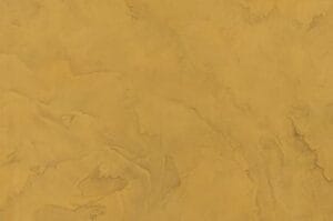 Amostra de microcimento PURE base cal KCberry na cor Saffron — textura mineral continua, sem juntas