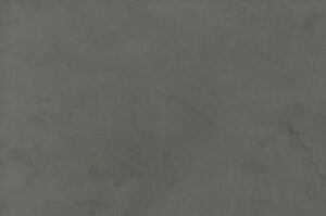 Amostra de microcimento PURE base cal KCberry na cor Scoria — textura mineral continua, sem juntas